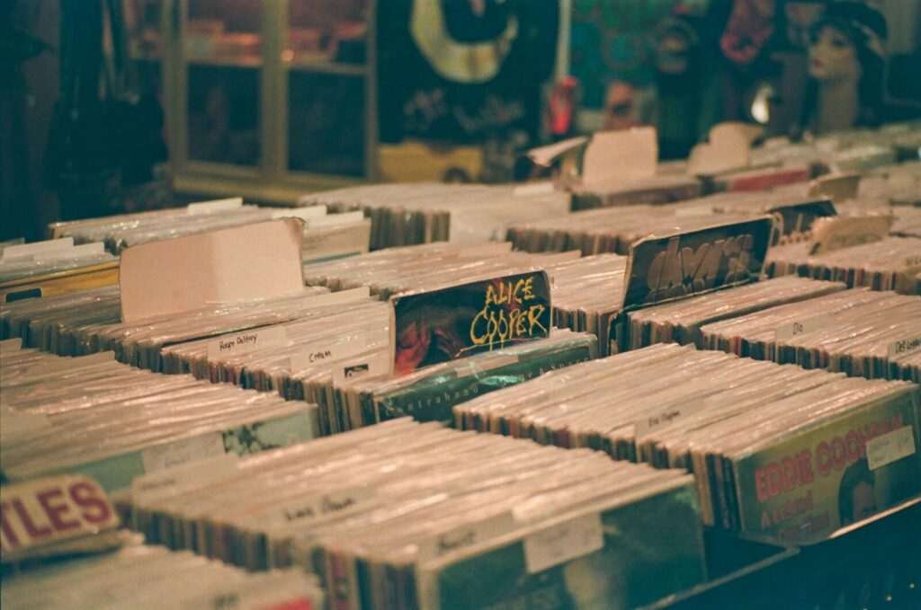 Rows of vintage vinyl records displayed for sale.