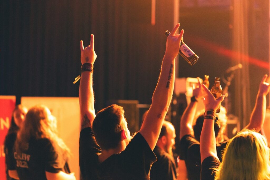 a group of people raising their hands in the air